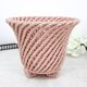 Small vintage handmade plant pot in pink woven ceramic