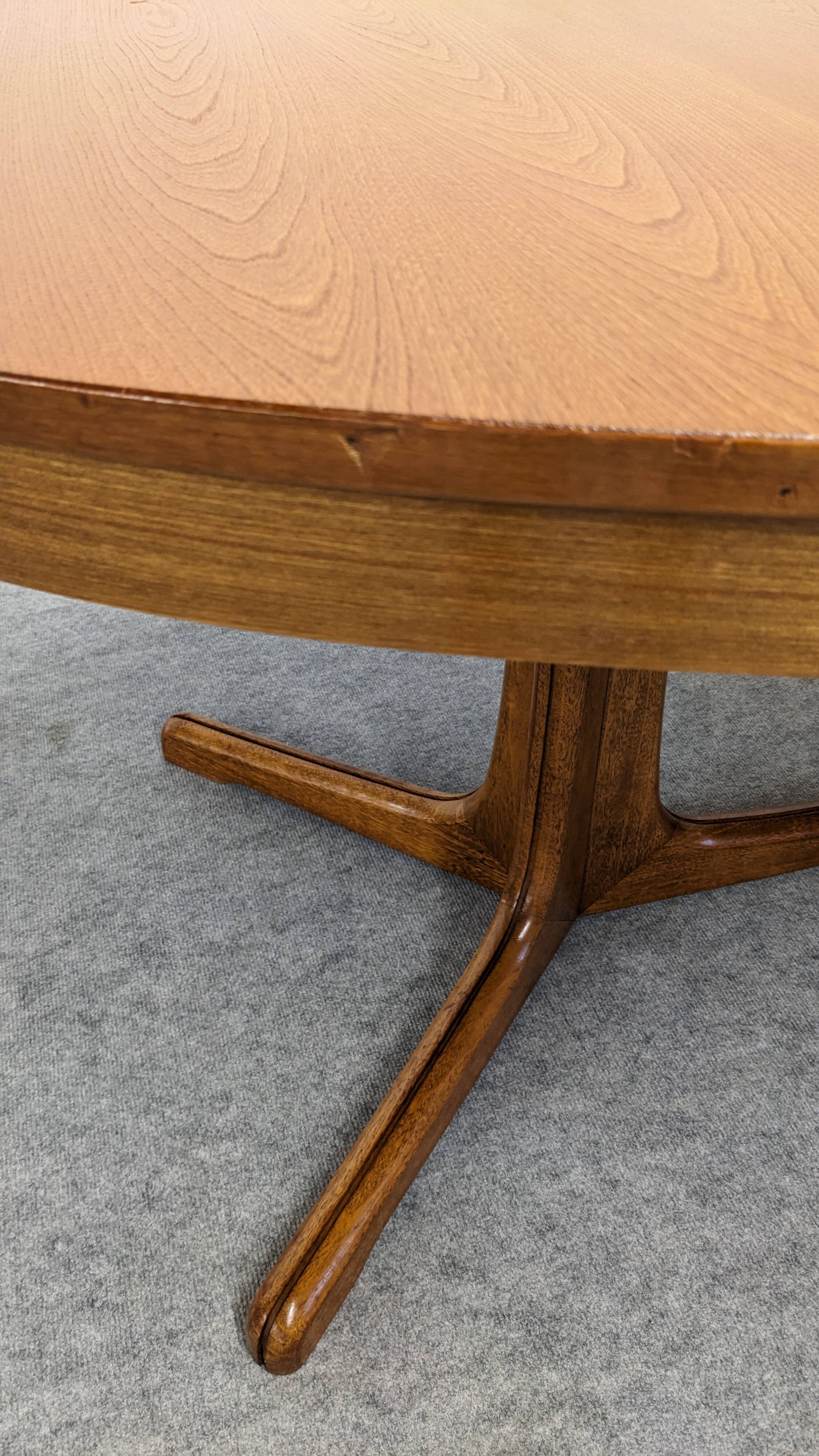 Oval extendable dining table by Baumann, France circa 1970.