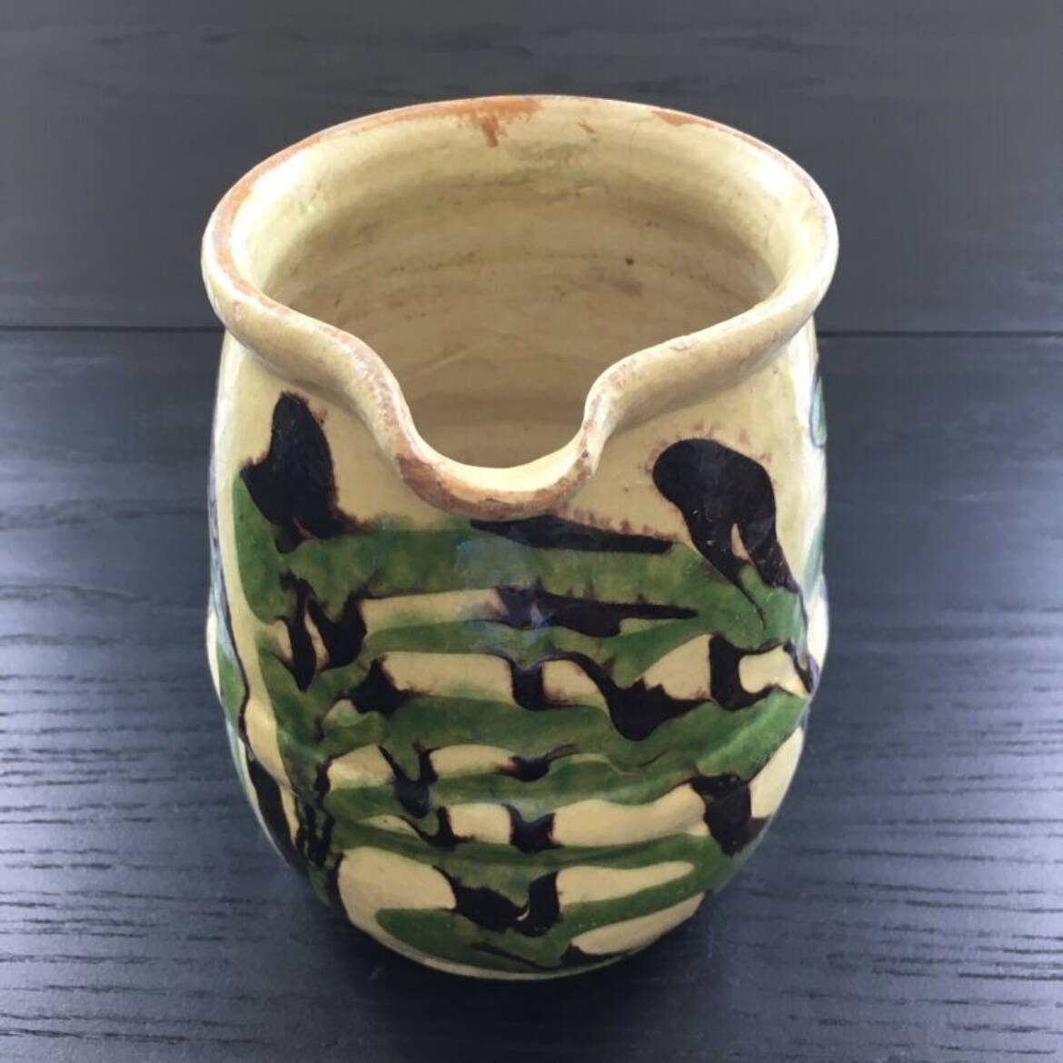 Antique pitcher of mixed earth