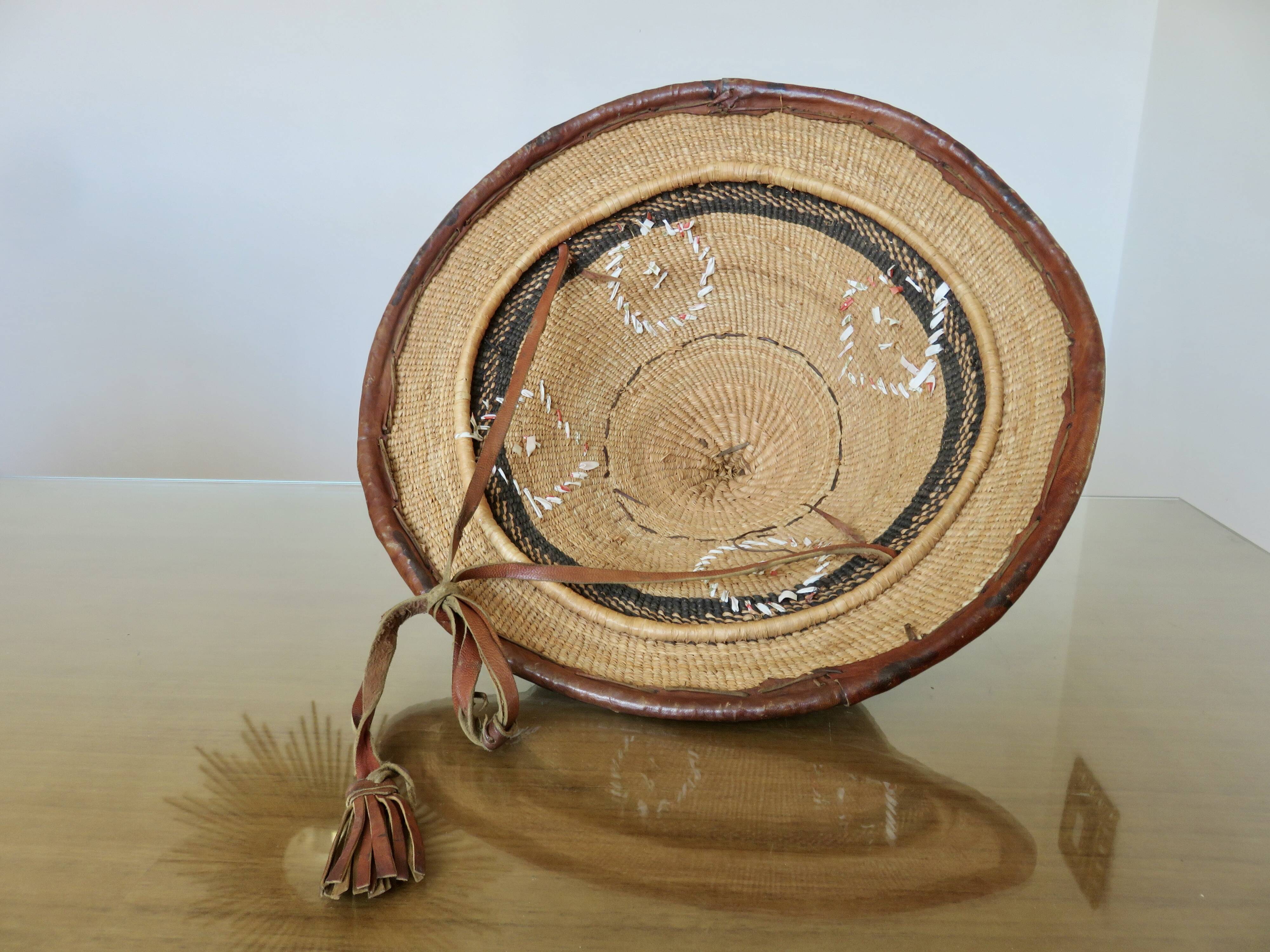 African conical hat, Fulani, in leather and braided rope, 1900, wall decoration