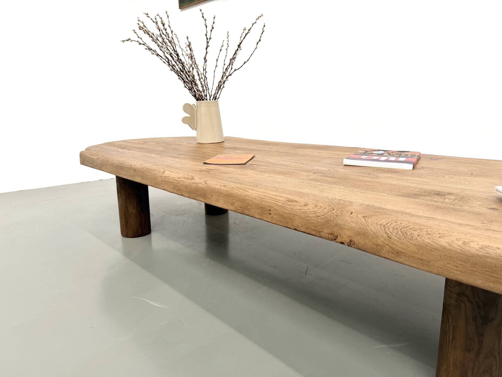XXL oval coffee table in solid oak, cylindrical base, 1950s.