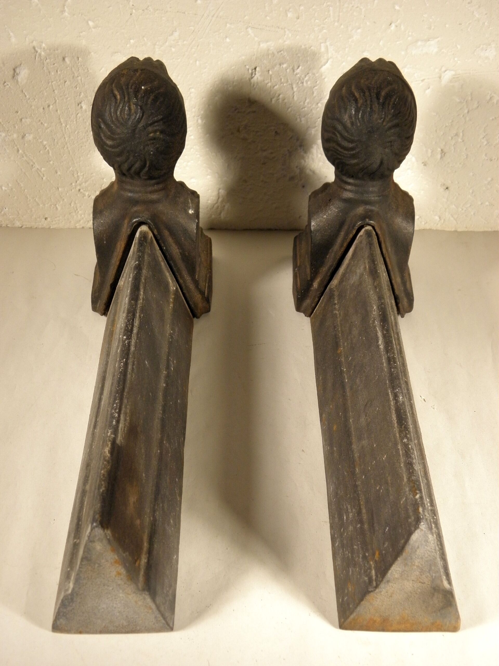 Old cast iron chenets