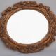 Oval mirror in gilded and carved wood. Vintage mirror. Wall mirror.