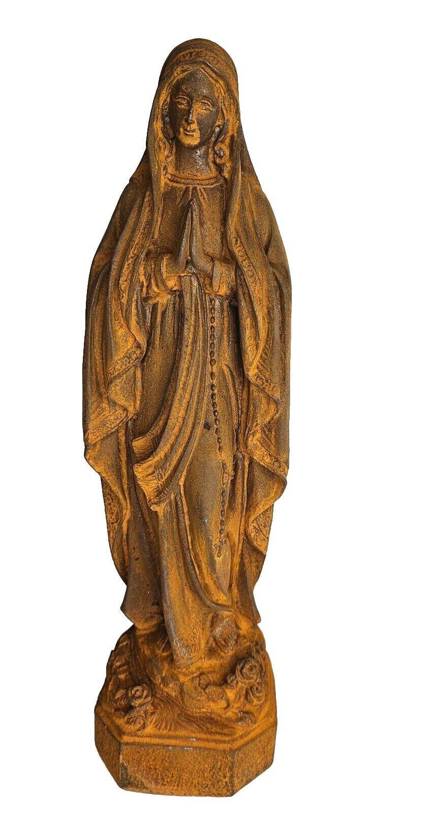 cast iron statue of the virgin