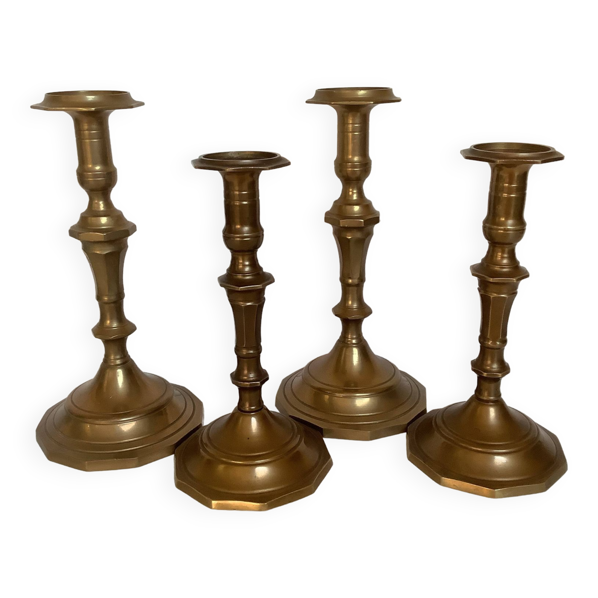 Four brass candle holders