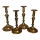 Four brass candle holders
