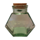 Old thick glass of a light green jar