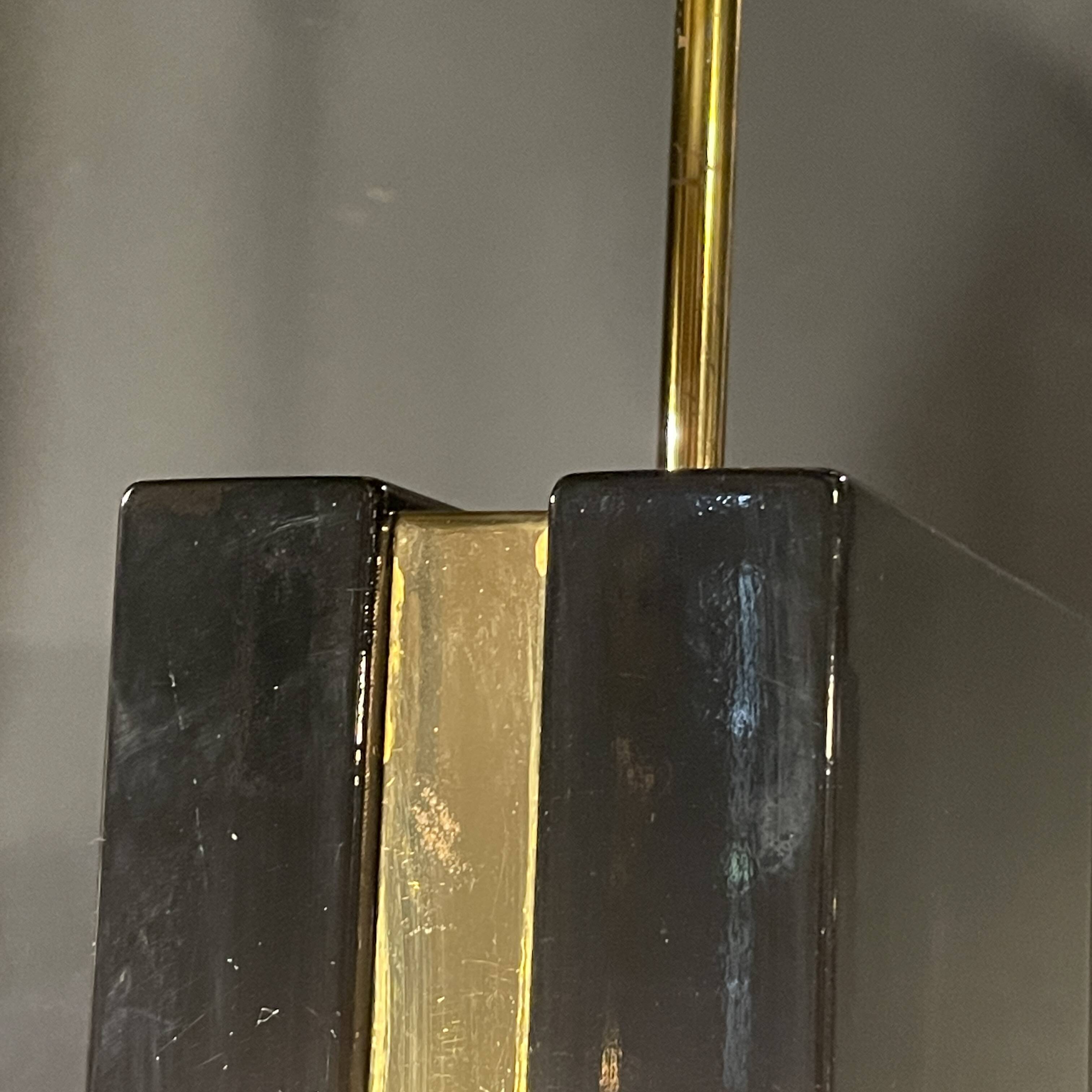 Pair of black lacquered and brass table lamps, circa 1970