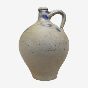 Old potiche jug in sandstone of Alsace