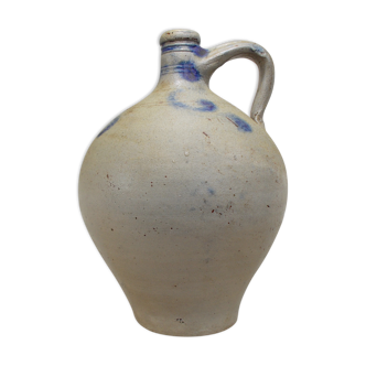 Old potiche jug in sandstone of Alsace