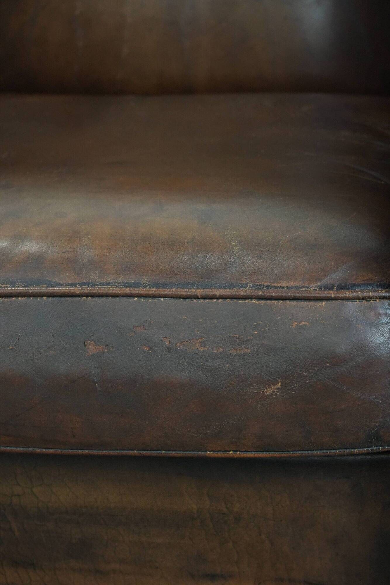 Characterful set of two vintage sheepskin armchairs with beautiful colours