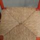 Set of two red vintage wooden chairs from the 1970s with woven rattan seats
