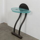 Artisanal wrought iron and cast glass leaning console table