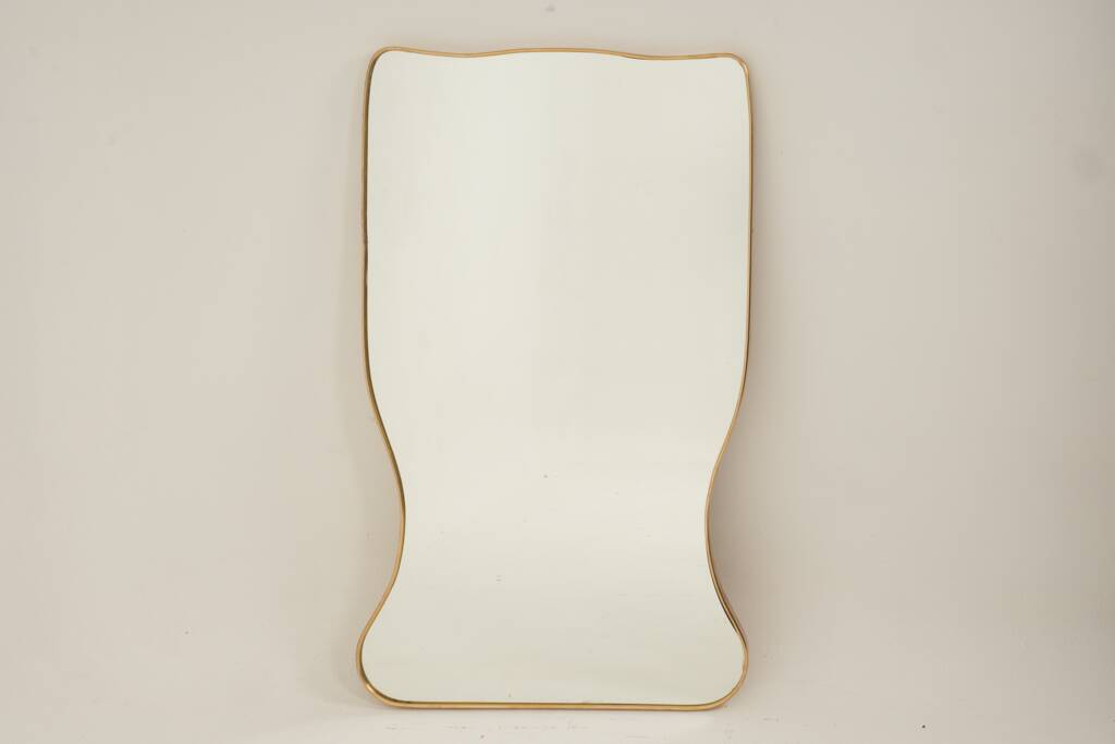 Golden brass mirror in the style of Gio Ponti and the 1980s.