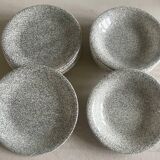 12 speckled ceramic plates.