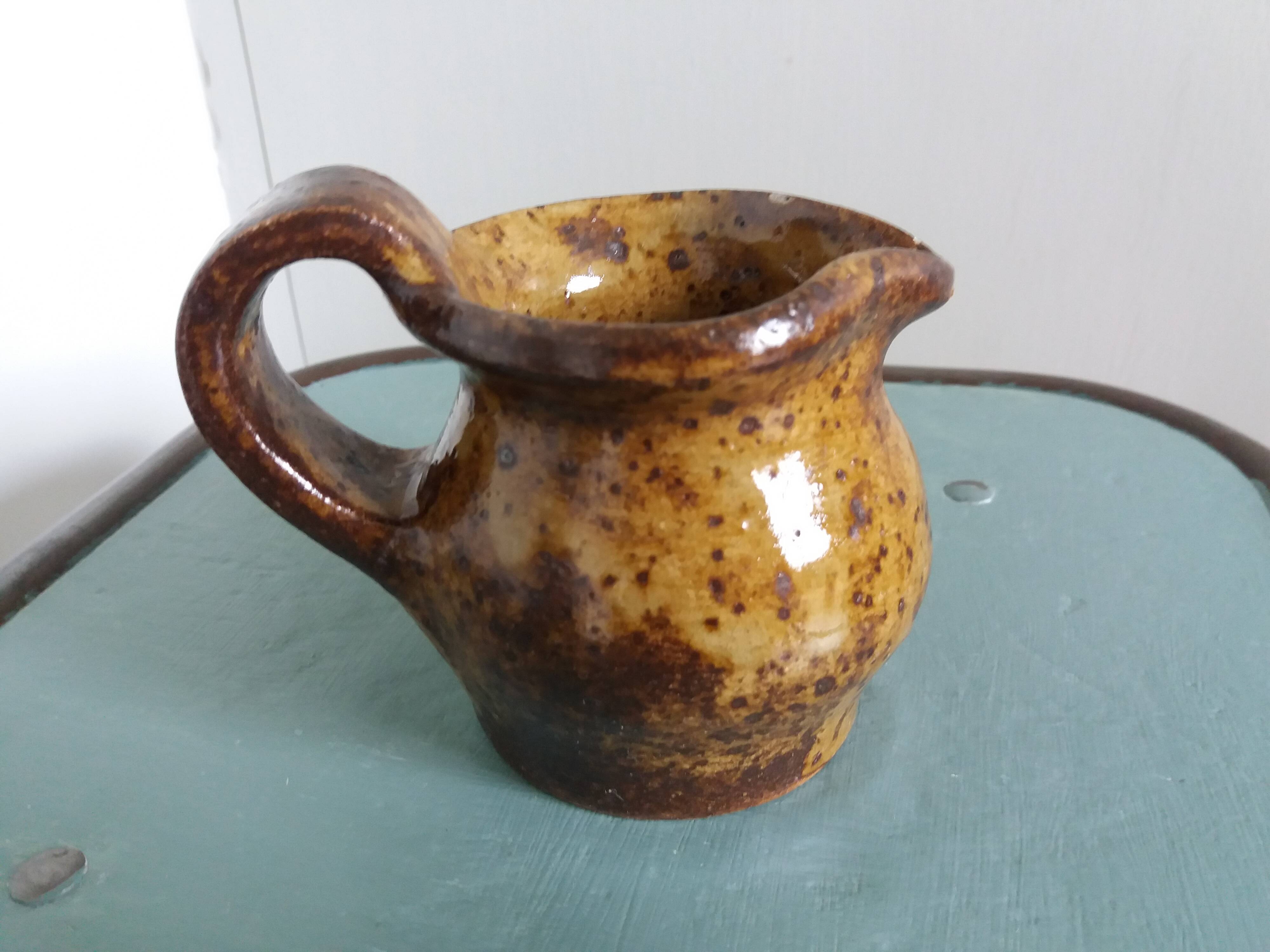 Stoneware pitcher signed cg