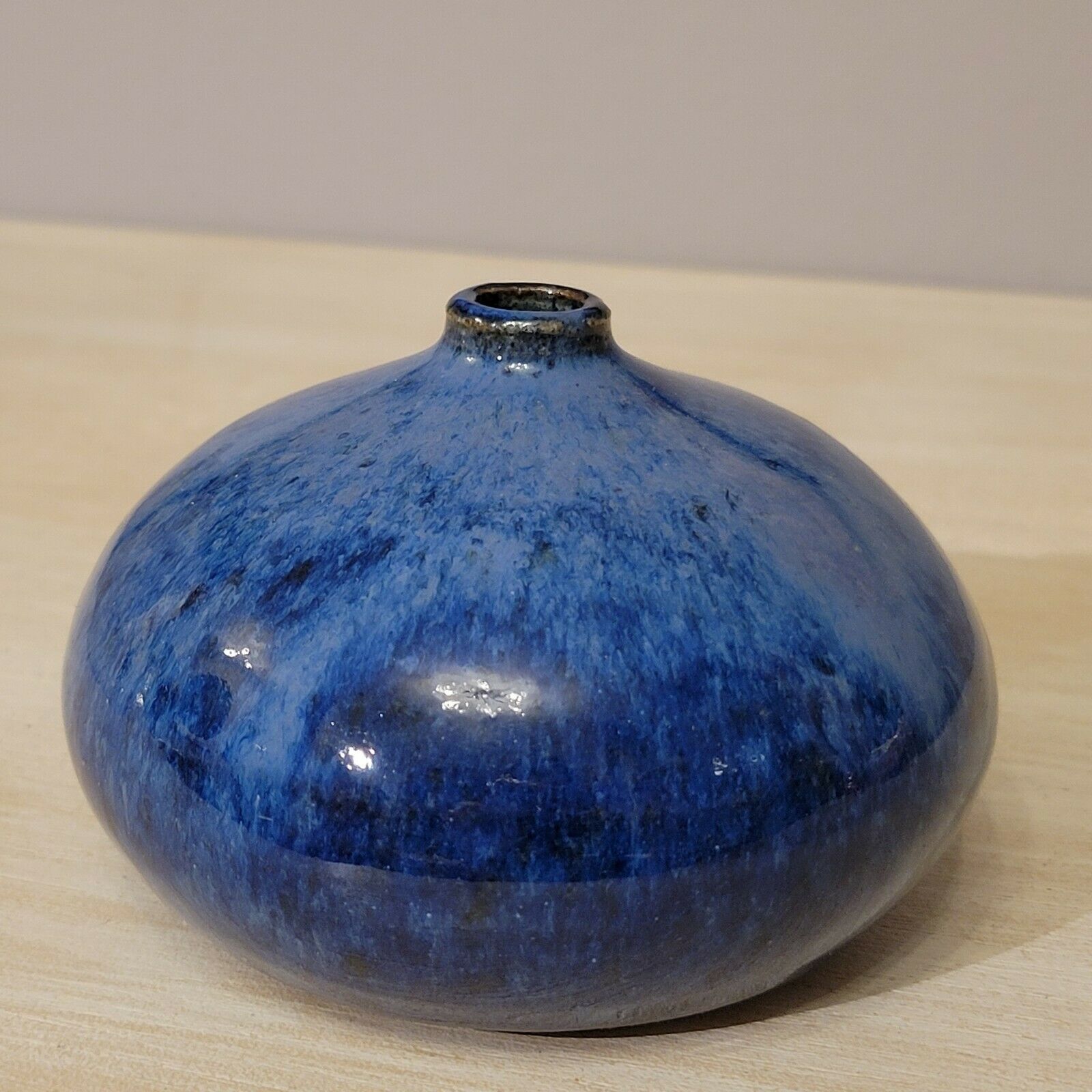 Small blue enamelled ceramic ball vase