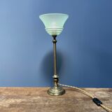 Ornate brass table lamp with mint green glass shade