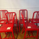 Set of 6 red Emeco chairs