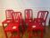 Set of 6 red Emeco chairs