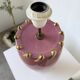 Pink and gold ceramic tripod table lamp