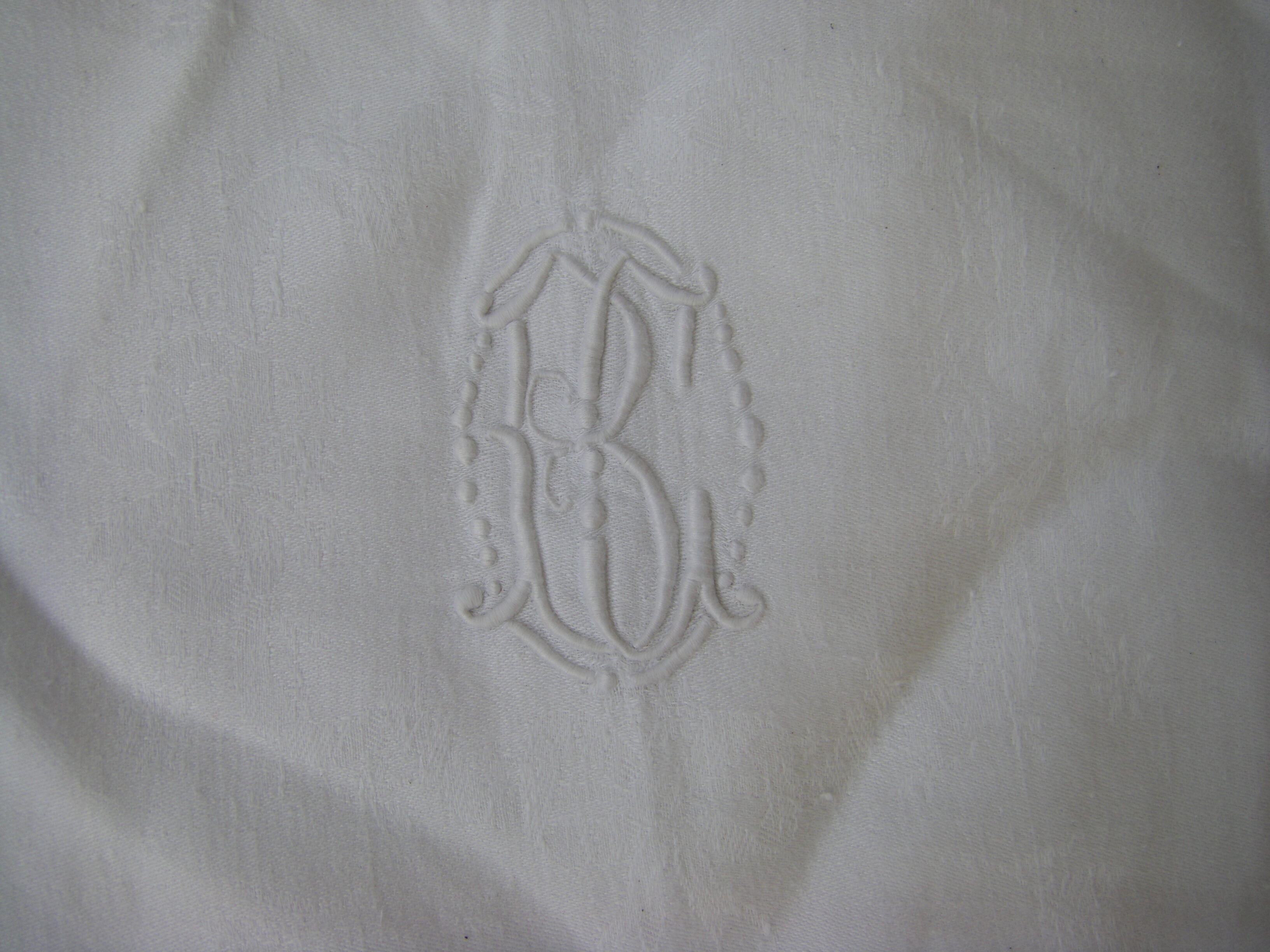 Tablecloth and its twelve monogrammed towels.