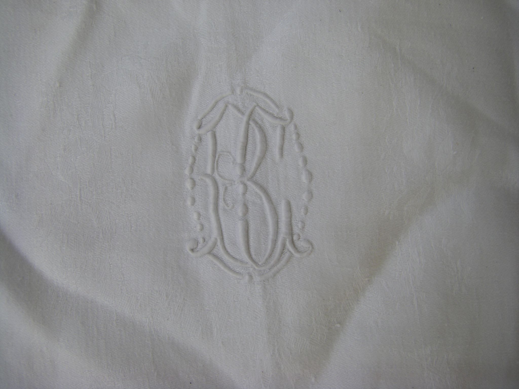Tablecloth and its twelve monogrammed towels.