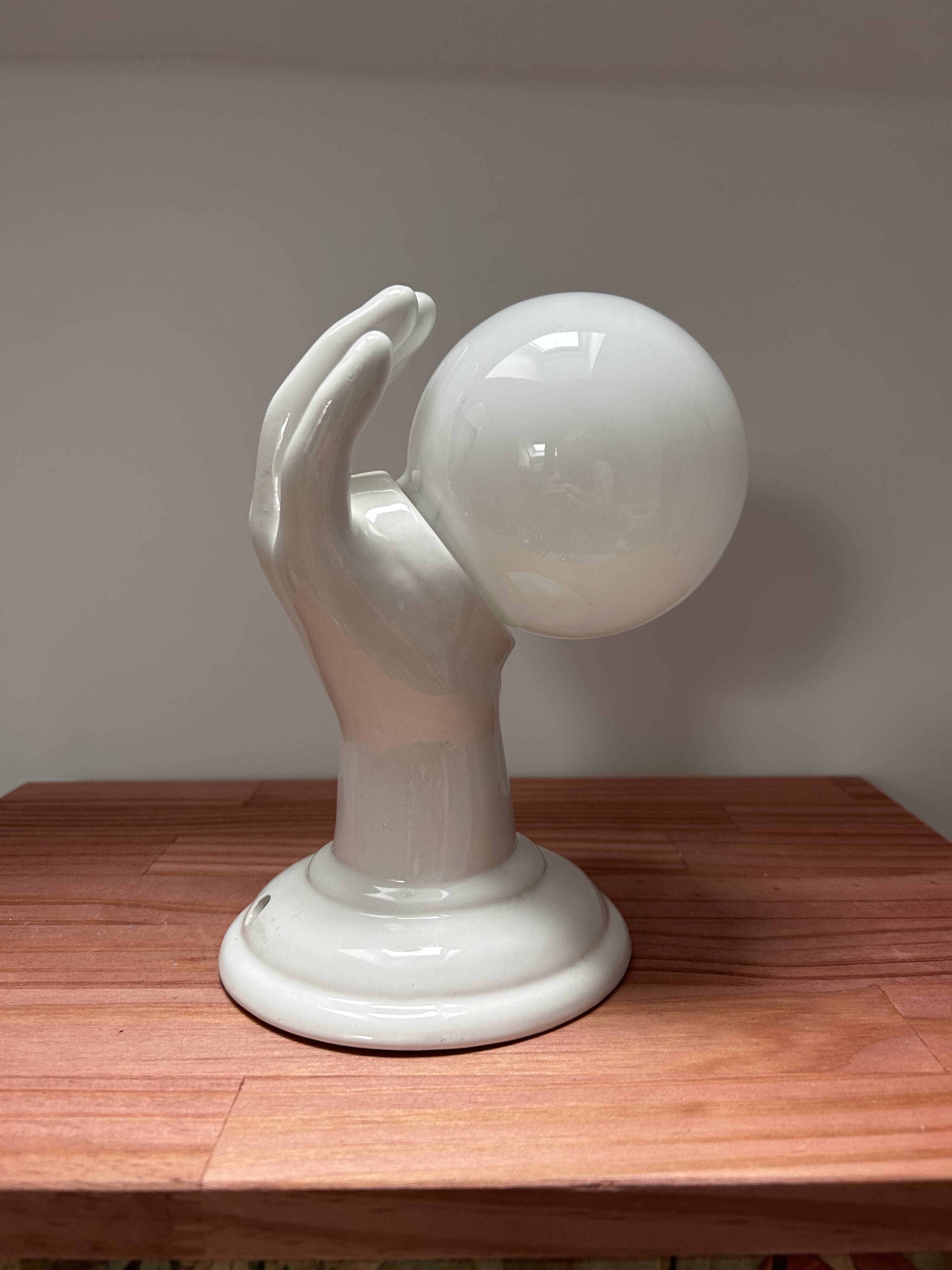 Ceramic hand wall light