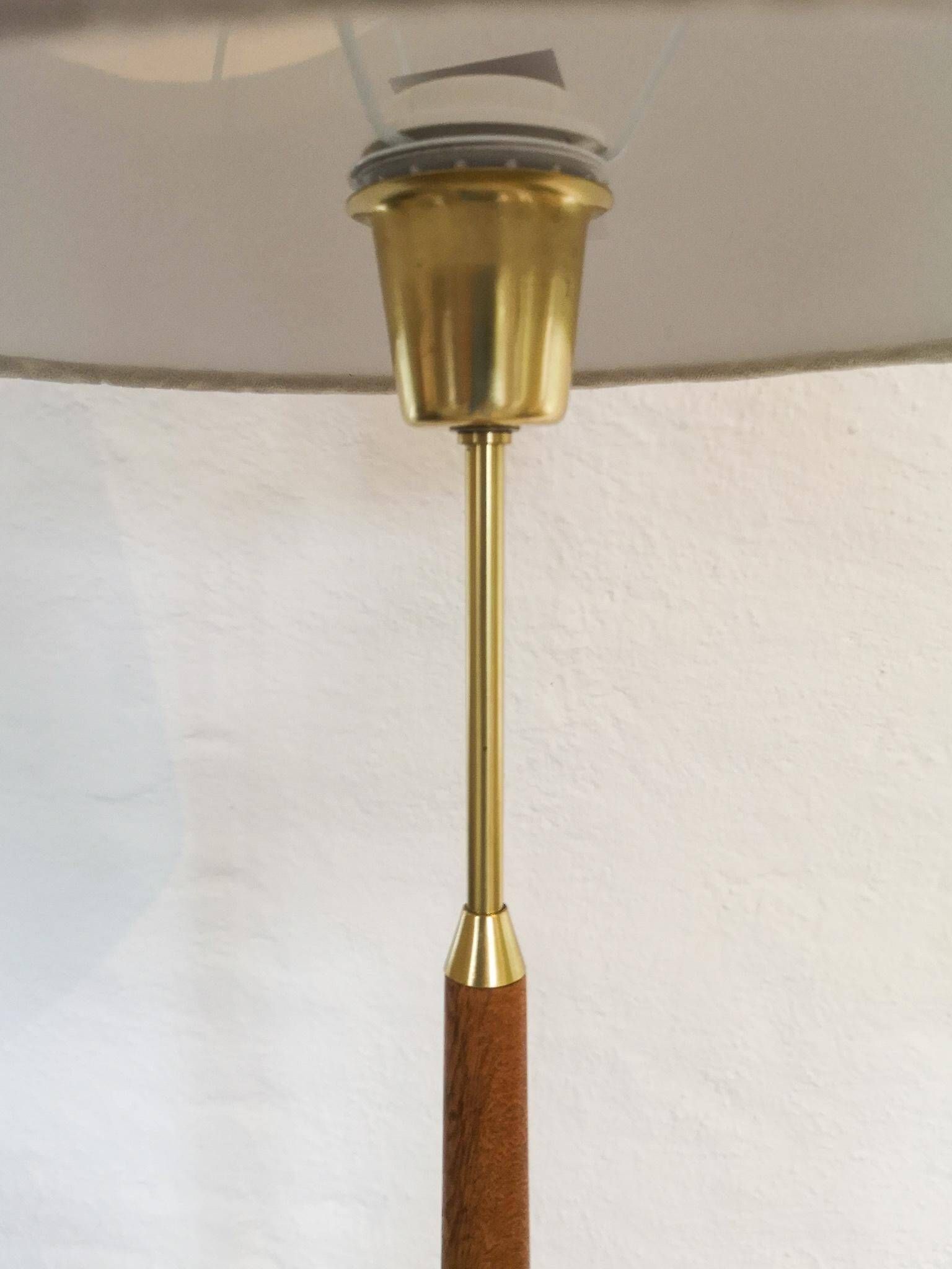 Mid-century floor lamp in teak and brass by Falkenbergs Belysning, Sweden, 1960s.