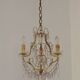 French gilt bronze three-light cage chandelier with pink and clear beaded swags.
