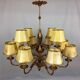 Golden luster with 12 arms of light decorated with leaves 1940