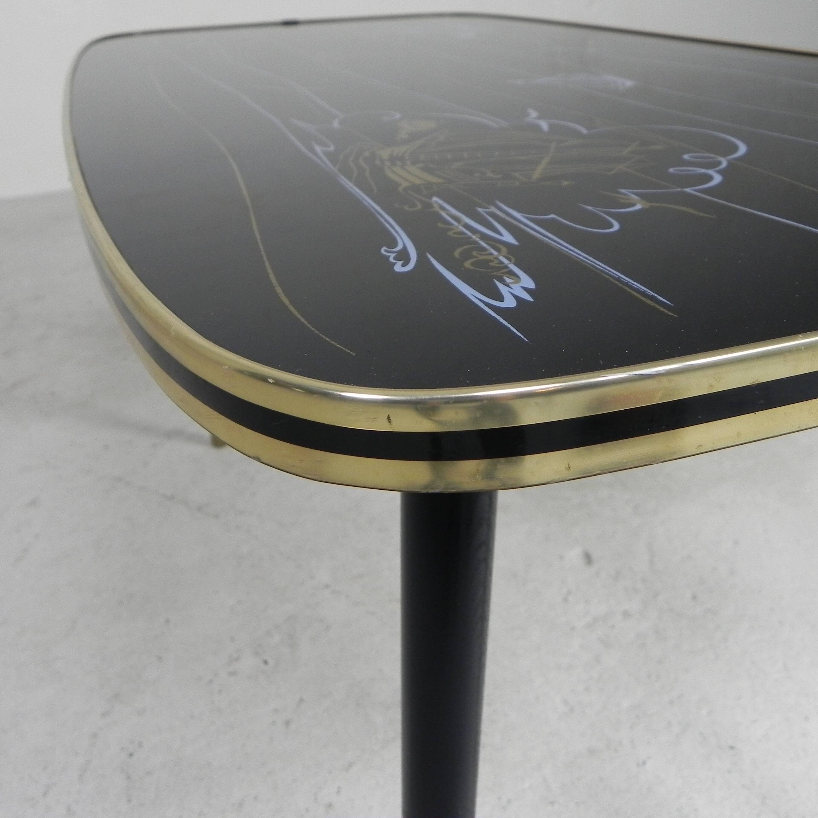 Vintage coffee table with glass top and angled legs