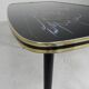Vintage coffee table with glass top and angled legs