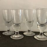 12 old glasses on foot at bistro or absinthe