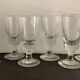 12 old glasses on foot at bistro or absinthe