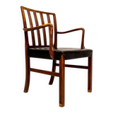 Mid-century armchair by Ole Wanscher for Fritz Hansen, stained beech and leather.