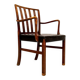 Mid-century armchair by Ole Wanscher for Fritz Hansen, stained beech and leather.