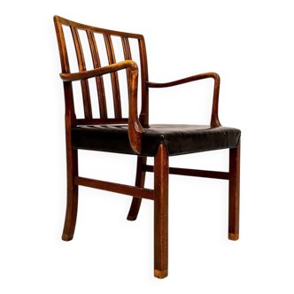 Mid-century armchair by Ole Wanscher for Fritz Hansen, stained beech and leather.