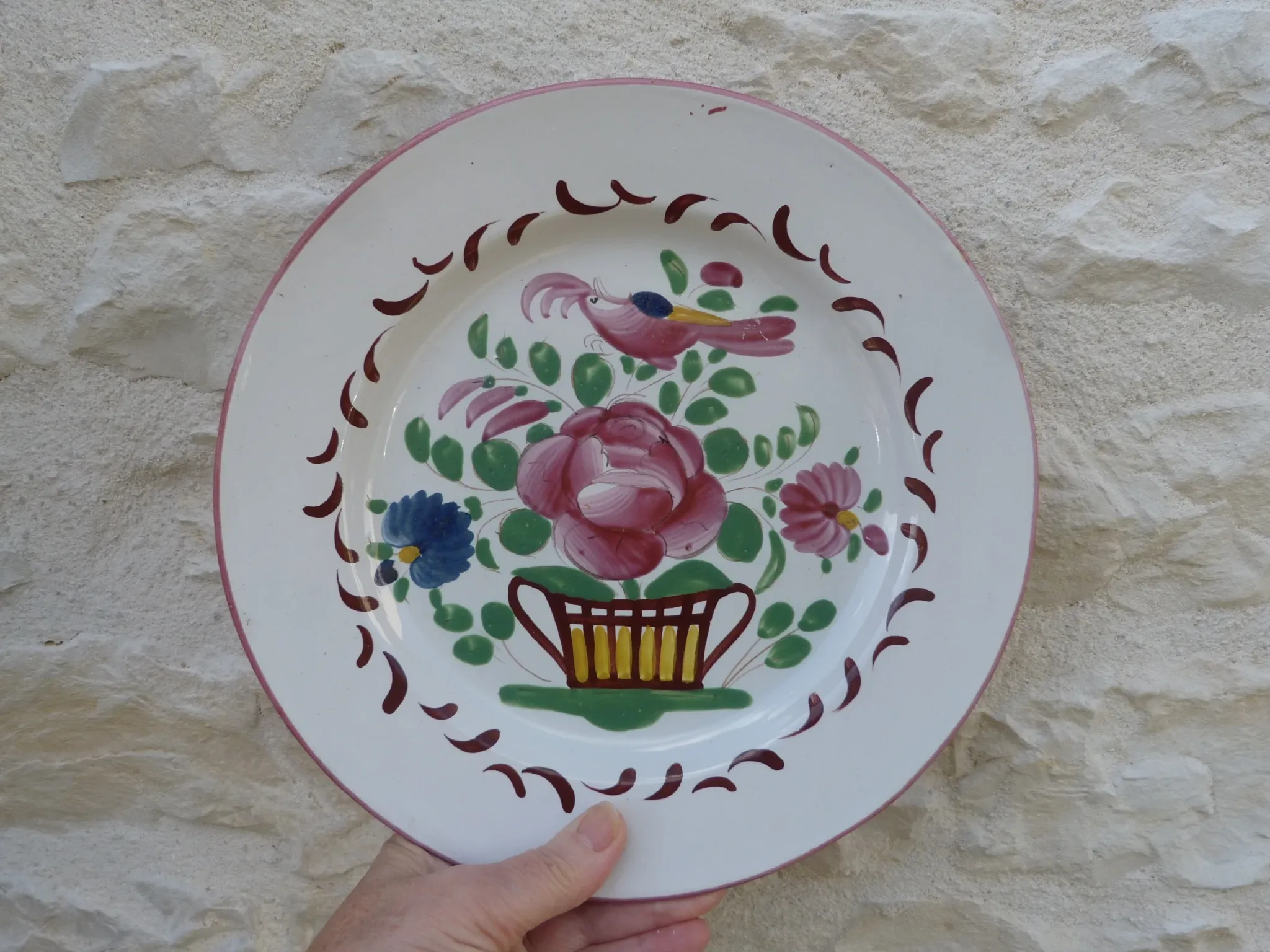 Old St Clément earthenware plate, flat plate with flower patterns.