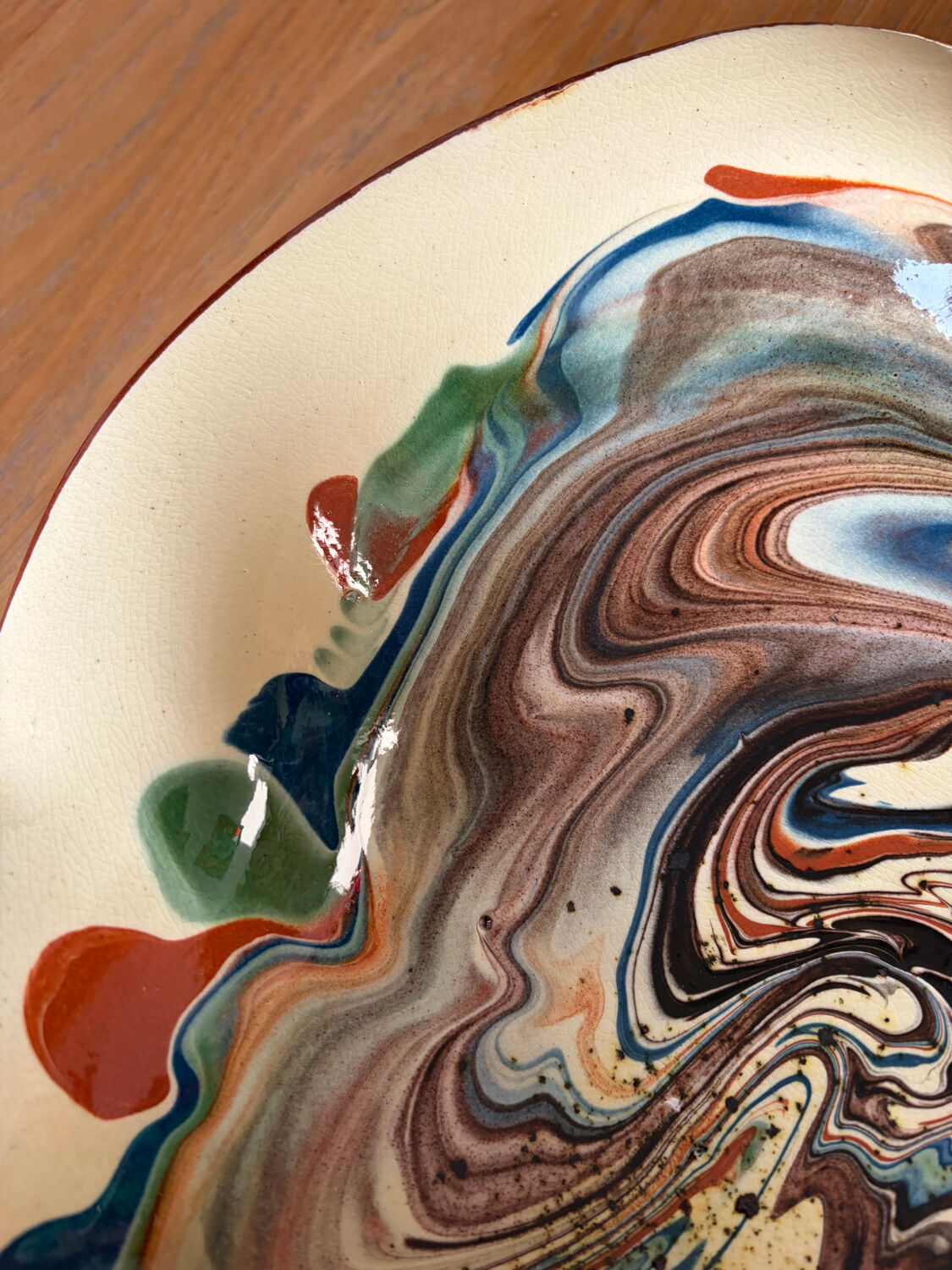 Glazed ceramic plate signed