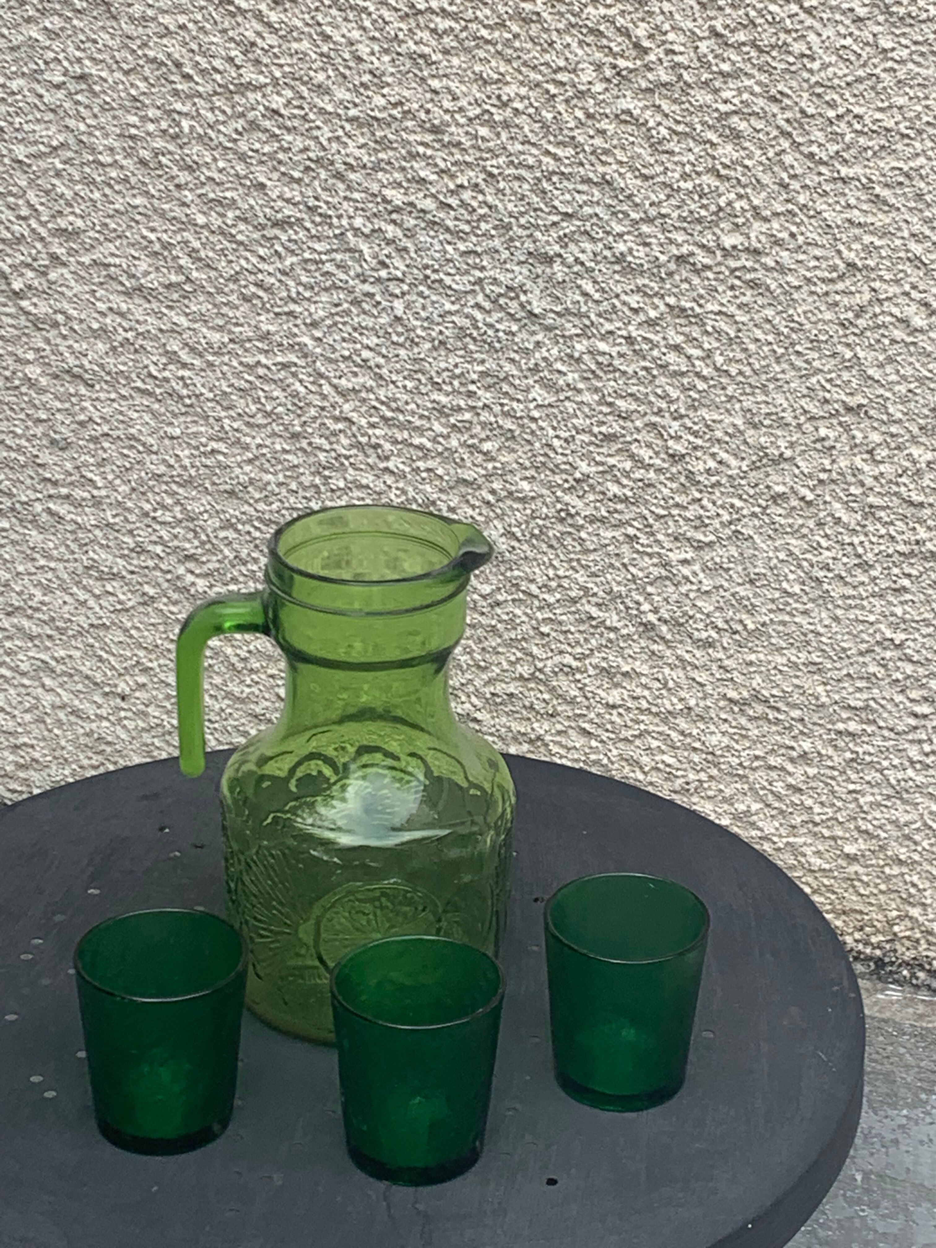 Carafe and 3 green glass glasses with vintage embossed fruit pattern