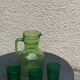 Carafe and 3 green glass glasses with vintage embossed fruit pattern