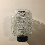 Black metal and molded glass wall sconce