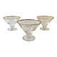 Trio of glass dessert bowls with gold rims, La Rochère, France