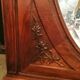 Old oval walnut wood mirror has flower carvings decoration