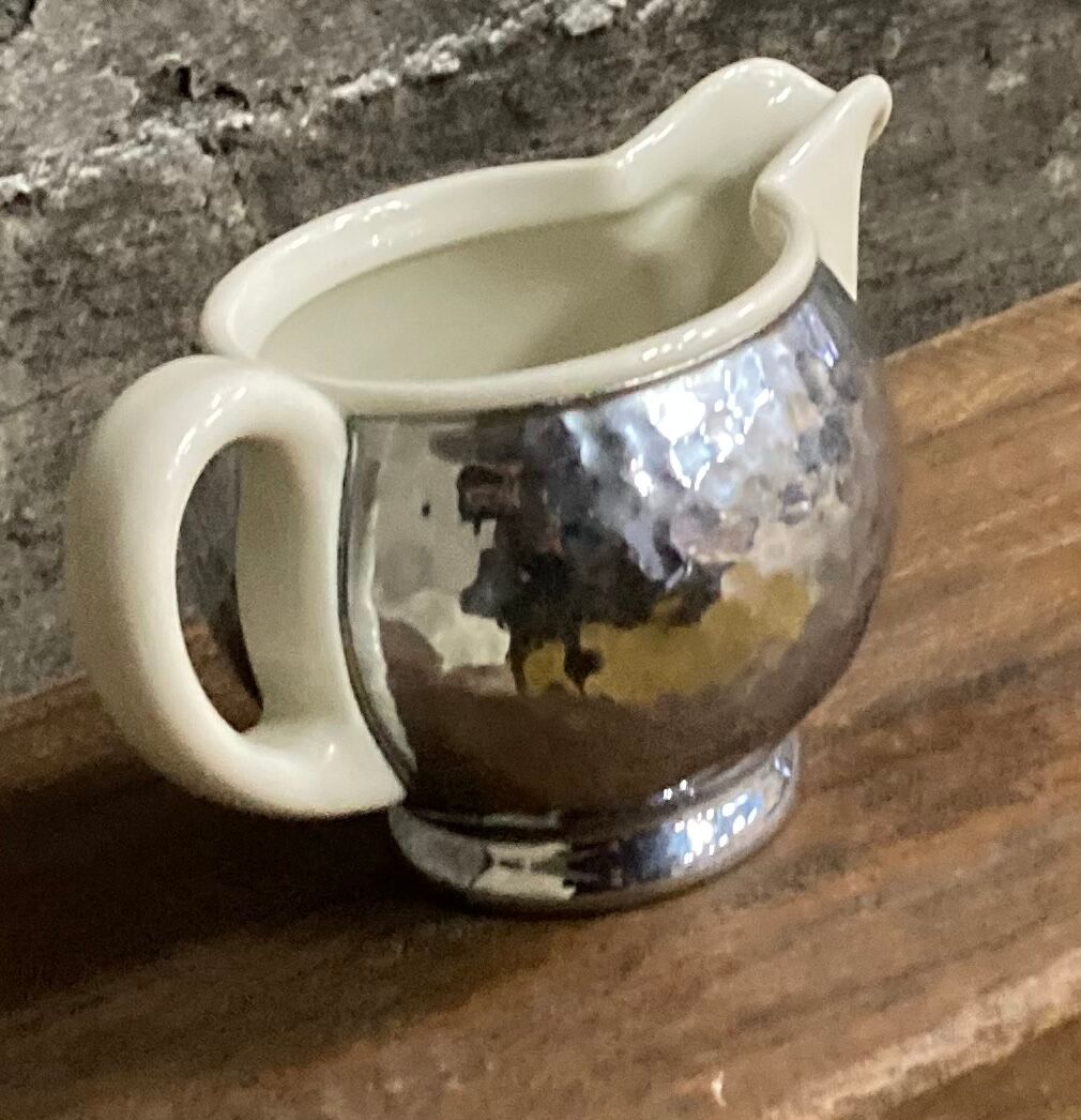 Ceramic/tinned milk jug.