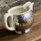 Ceramic/tinned milk jug.