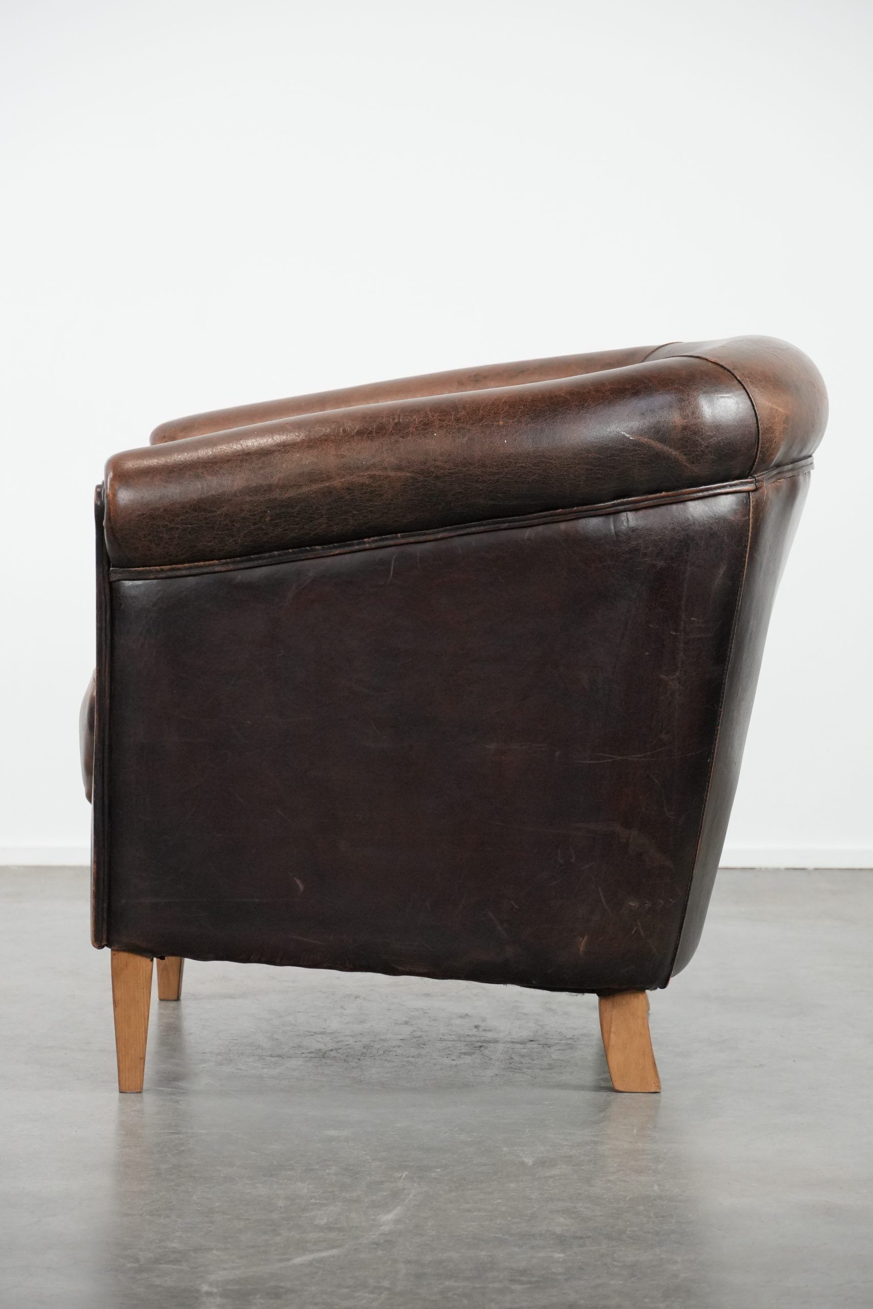 Characterful club armchair made of sheepskin with a beautiful patina