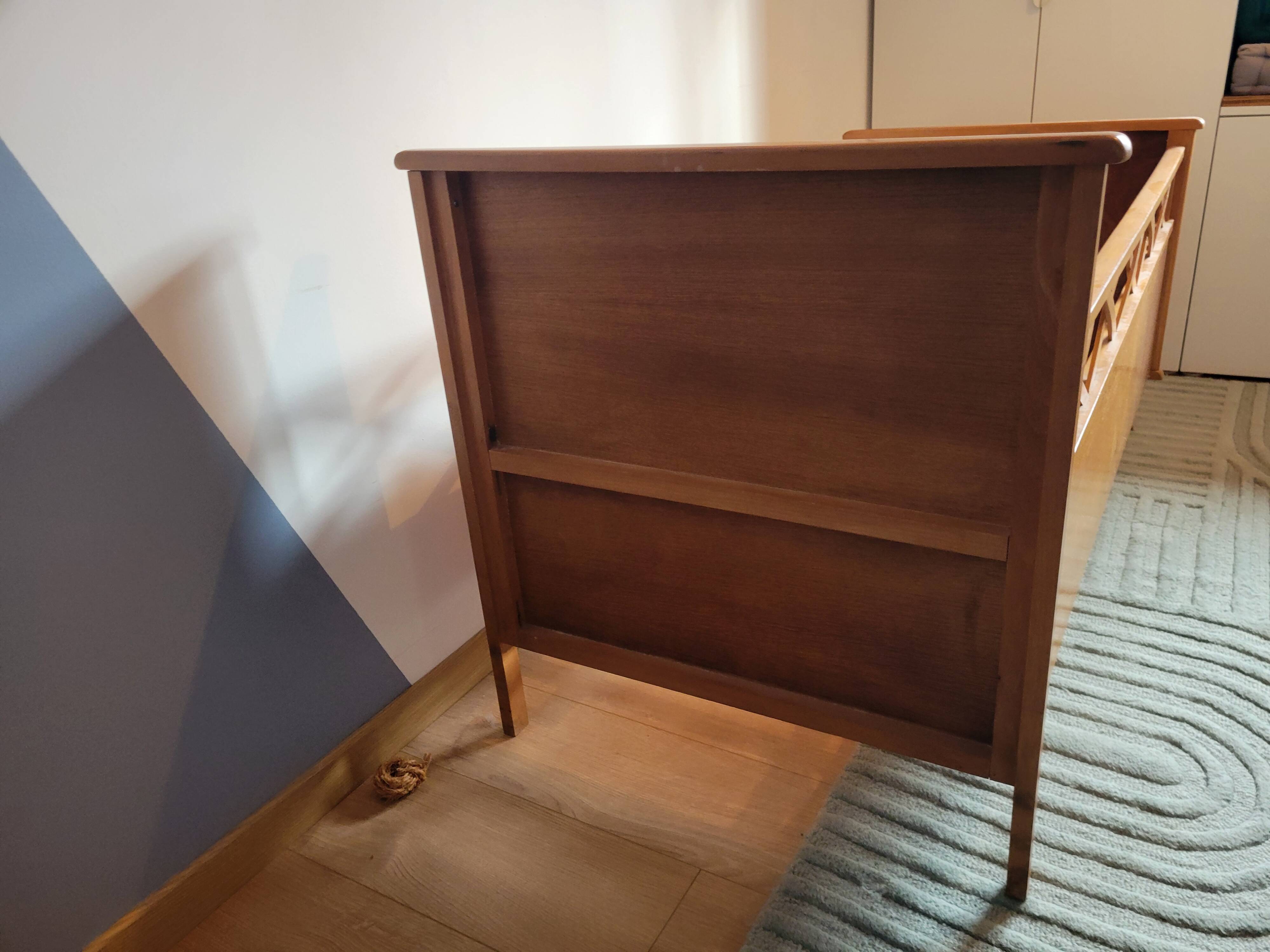 Vintage baby cot with splayed legs.