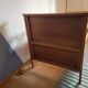 Vintage baby cot with splayed legs.